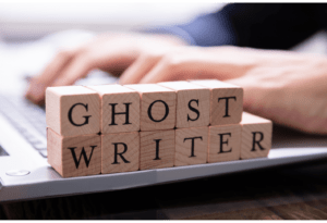 Blocks in front of a person typing that spell ghostwriter